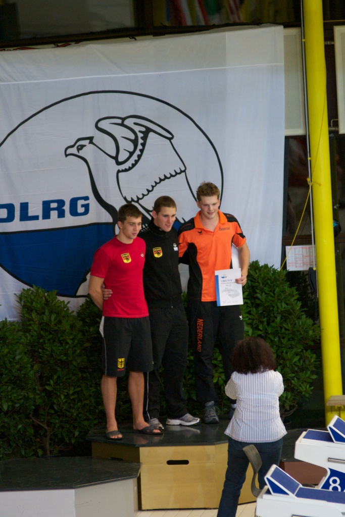 Martin (r) op het podium naast Jan Ertel (l) en Dhr. Grasmaaier (m).